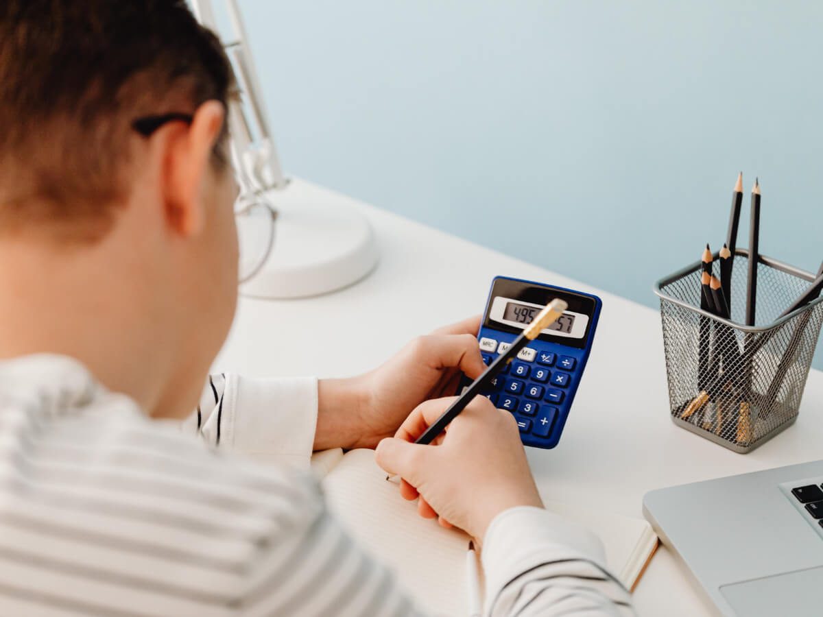Man use calculator for money analysis